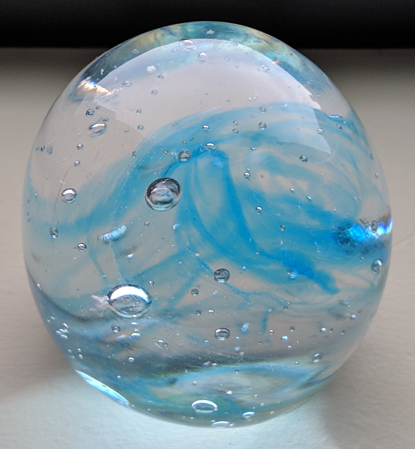 small blue swirly paper weight